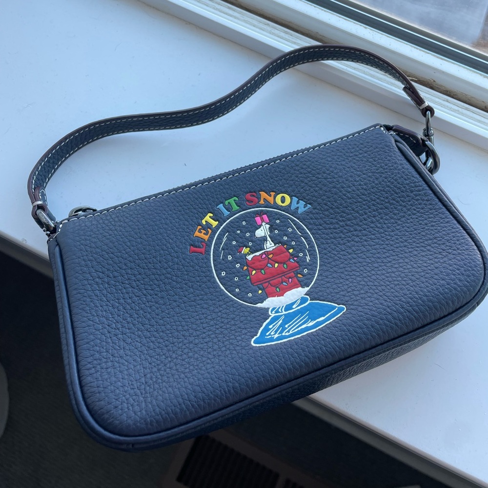 Coach “Let it snow” Snoopy Wristlet